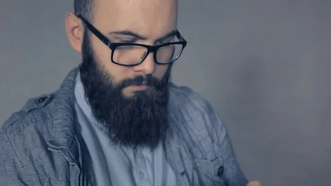 Mobile technology and digital device addiction. smiling man holding phone. Stock Footage 104262604