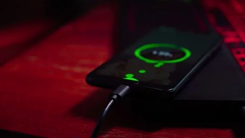 Mobile technology devices can be charged from the notebook. Stock Footage 136750530