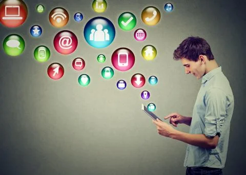 Mobile technology high tech concept. Side profile of a man using tablet compu Stock Photos