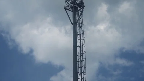 Mobile telecommunication tower on the background of the rainy clouds Stock Footage 75913771