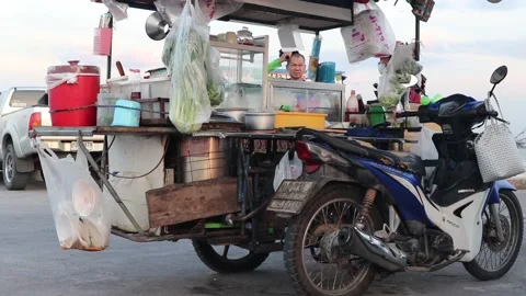 Mobile Thai food stand coupled with a motorbike Stock Footage 228822559