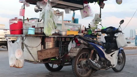 Mobile Thai food stand coupled with a motorbike Stock Footage 228822564