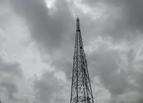 A mobile tower in a cloudy sky Stock Photos
