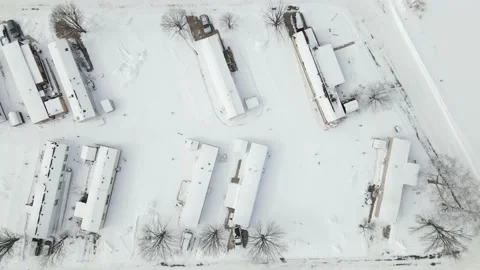 Mobile trailer housing development flyover after a snowfall Stock Footage 149068591