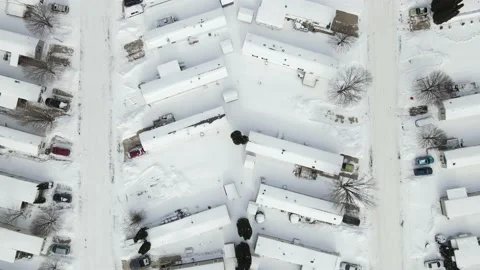 Mobile trailer housing development flyover after a snowfall Stock Footage 149068671