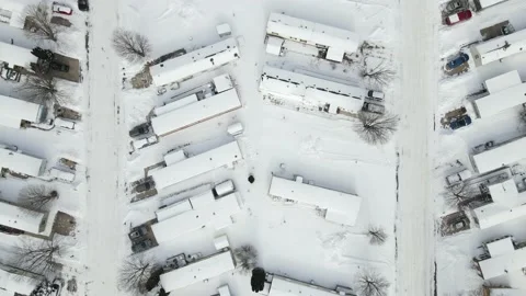 Mobile trailer housing development flyover after a snowfall Stock Footage 149068827
