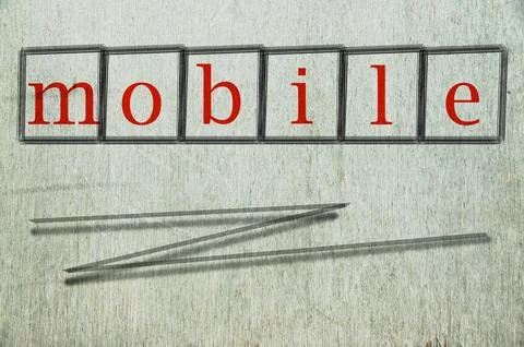 Mobile writen on a wall background Stock Photos