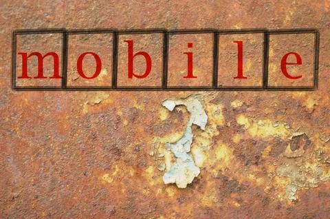 Mobile written on a wall background Stock Photos