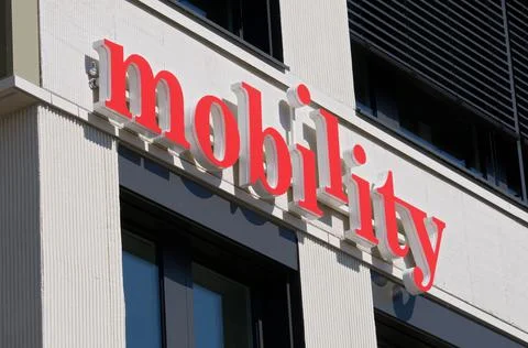 Mobility carsharing group sign hanging on a building in Switzerland Stock Photos