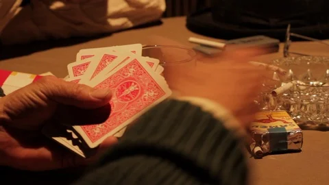 Mobsters gambling and shuffling playing cards, drinking, smoking in 1920s/1930s Vidéo 106947045