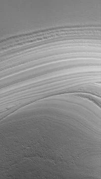 This MOC image shows an unconformity in a sequence of layered material in ... Stock Photos