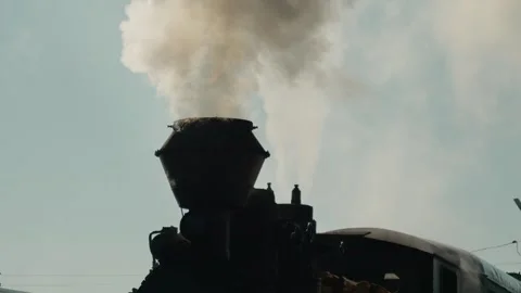 Mocanita steam train puffs smoke at Bucovina station in Romania Stock Footage 346717341