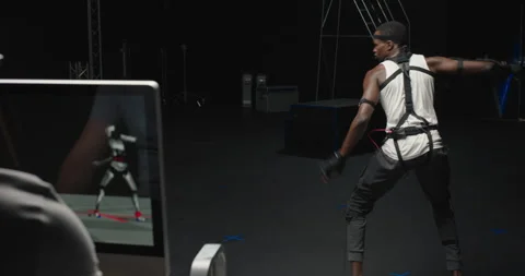Mocap man wearing motion capture suit in studio performing  bo staff sword Stock Footage 138391473