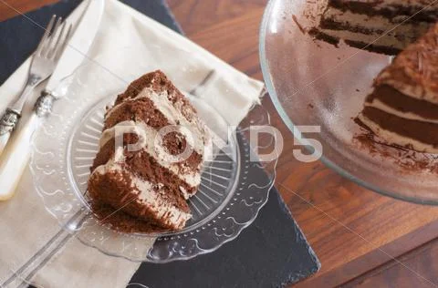 Mocha Cake With Grated Chocolate On A Glass Plate