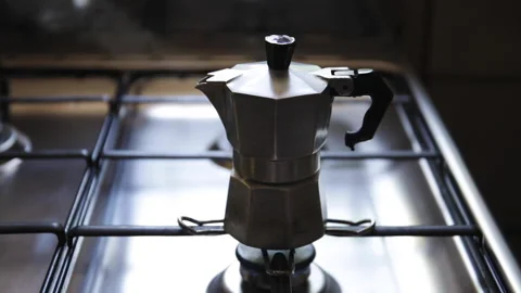 Mocha coffee maker on the kitchen stove boiling. Making coffee with the moka. Stock-Footage 170883844