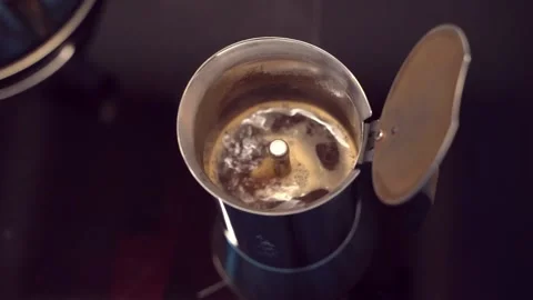 Mocha coffee preparing in moka coffee maker, brewing drink by passing boiling Stock Footage 148272111