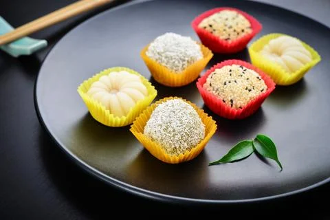 Mochi assortment on plate with chopticks 写真素材