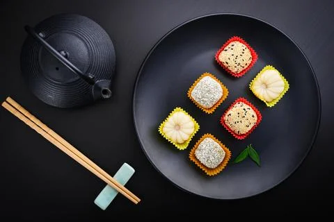 Mochi assortment on plate with chopticks Stock Photos