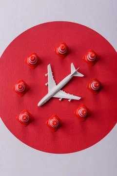 A mock up of airplane surrounded by no fly signs on a japanese flag Stock Photos