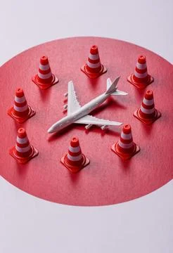 A mock up of airplane surrounded by no fly signs on a japanese flag Stock Photos