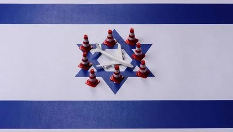 A mock up of airplane surrounded by no fly signs on a Israeli flag as a conce Stock Photos