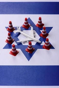 A mock up of airplane surrounded by no fly signs on a Israeli flag as a bac.. Stock Photos
