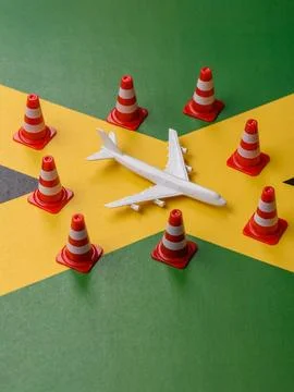 A mock up of airplane surrounded by no fly signs on a Jamaica flag as a conce Stock Photos