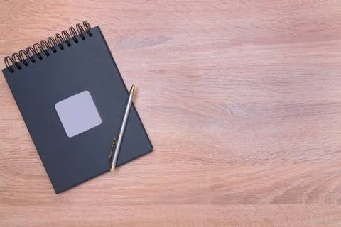 Mock up, black notepad with silver handle Stock Photos