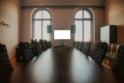 Mock-up of blank empty tv screen monitor in meeting business conference room Фото