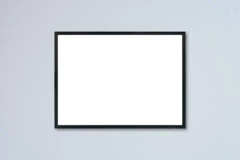 Mock up blank frame hanging on wall in room Stock Photos