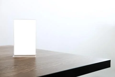 Mock up blank menu frame on table in coffee shop stand for your text of displ Stock Photos