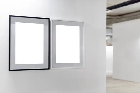 Mock up. Blank picture frames on white wall. Gallery wall with empty frames i Stock Photos