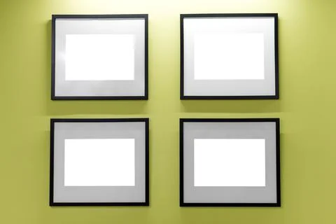 Mock up. Blank picture frames on yellow wall. Gallery wall with empty frames  Stock Photos