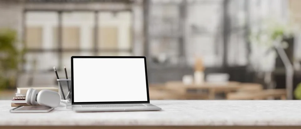 Mock up blank screen laptop computer on the counter with notebook and stati.. Stock Illustration