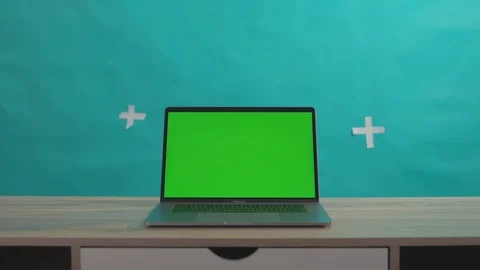 Mock-up chrome key greenscreen computer laptop on office desk isolated on green Stock Footage 116167454