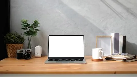 Mock up Copy Space Blank Screen workspace with computer laptop on table. Stock Photos