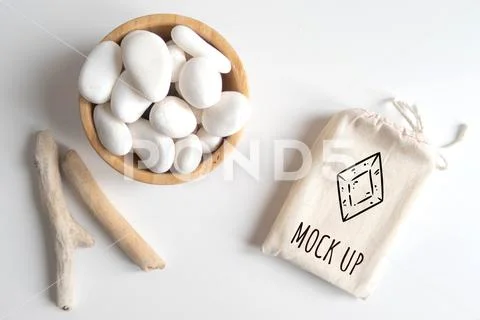 Mock up of cotton bag or pouch and bowl with white pebble PSD Template