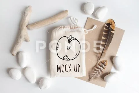 Mock up of cotton bag or pouch and rustic elements on white table PSD Template