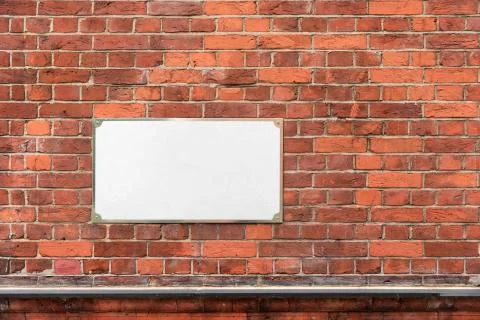Mock up with empty blank white address sign on a brick wall Stock Photos