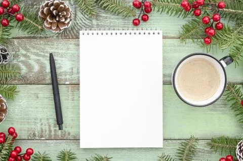 Mock-up empty notebook on New Year's green wood background with fir tree pine Stock Photos