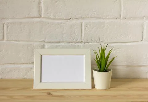 Mock up empty photo frame on table or shelf with copy space. Stock Photos