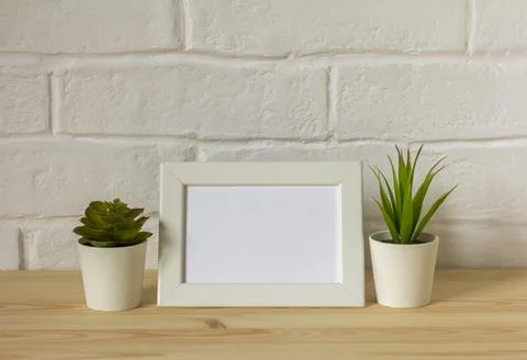 Mock up empty photo frame on table or shelf with copy space. Stock Photos