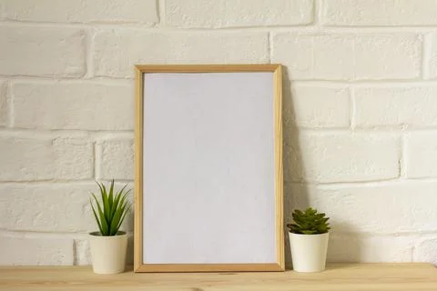 Mock up empty photo frame on table or shelf with copy space. Stock Photos