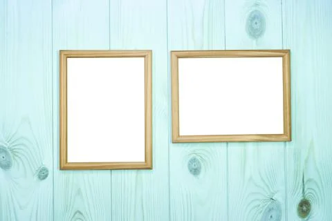 Mock up empty wooden frames on azure pine wood wall background, show text  Stock Photos