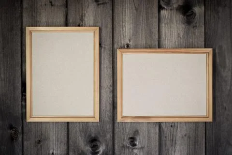 Mock up empty wooden frames on dark pine wood wall background, show text  Foto stock