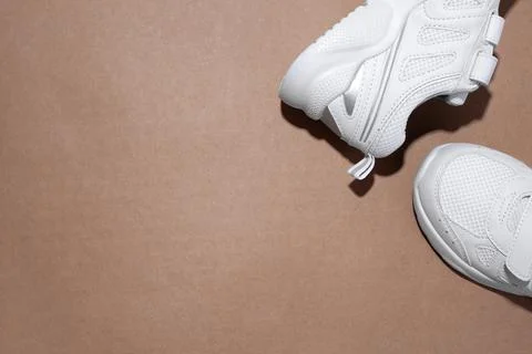 Mock up flat lay two white sneakers on the side in the corner with copy space Stock Photos