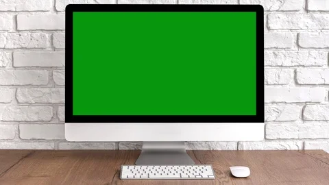 Mock up green screen computer desktop with keyboard and mouse on wooden table Video stock 122303068