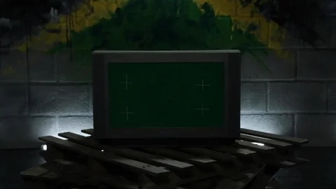 Mock-up Green Screen Modern TV in dark studio on wooden pallets and bright neon Видео 110770156