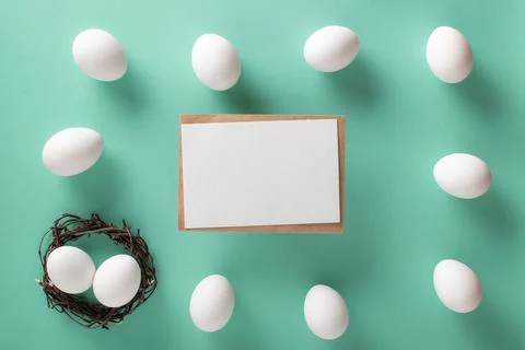 A mock-up of an invitation with an image of eggs on a light blue background Stock Photos