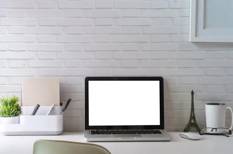 Mock up laptop computer, picture frame, coffee cup, books and pencil holder o Stock Photos